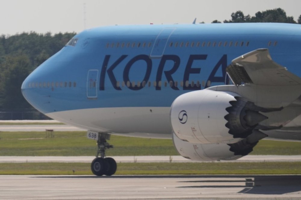 A Korean Air charter plane carrying Korean workers detained in immigration raid at Georgia factory leaves Hartsfield-Jackson International Airport in Atlanta bound for South Korea, Thursday, Sept. 11, 2025. (AP Photo/George Walker IV)