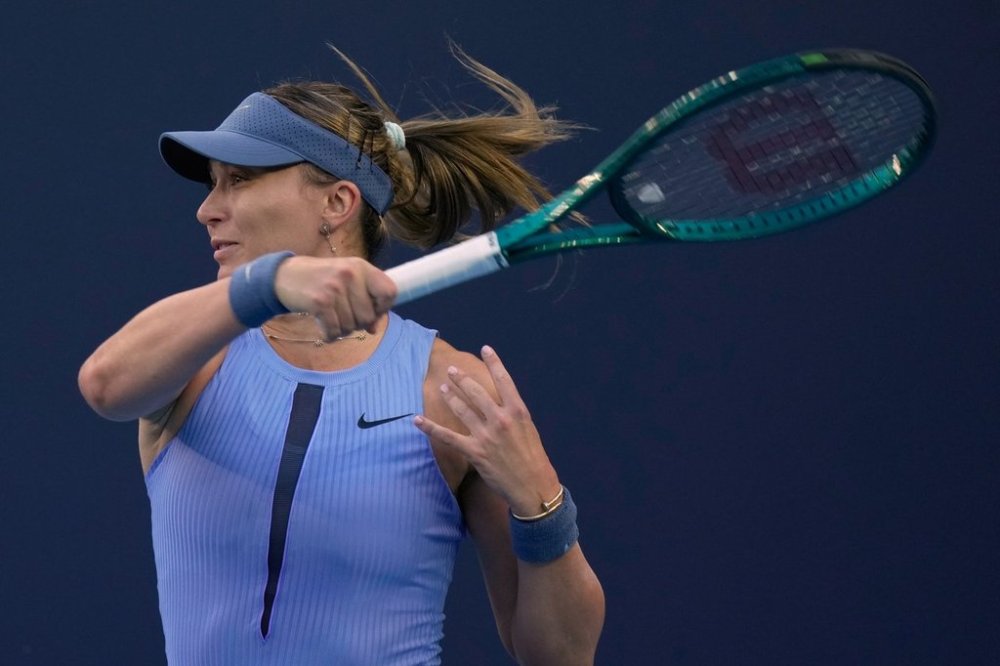 Paula Badosa of Spain plays a forehand return to Karolina Muchova, of the Czech Republic during a women's singles match of the China Open tennis tournament, at the National Tennis Center, in Beijing, China, Sunday, Sept. 28, 2025. (AP Photo/Mahesh Kumar A.)