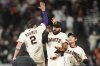 San Francisco Giants' Willy Adames (2) celebrates with Heliot Ramos, middle, and Jung Hoo Lee after a baseball game against the Arizona Diamondbacks in San Francisco, Monday, Sept. 8, 2025. (AP Photo/Jeff Chiu)