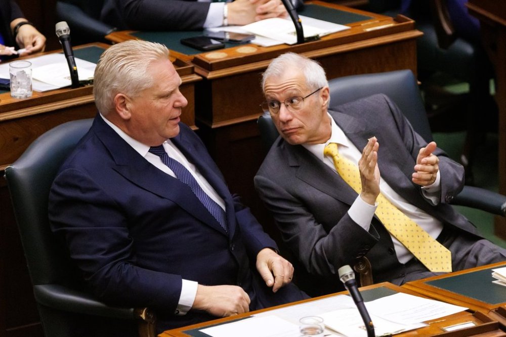 Ontario Premier Doug Ford, and Economic Development Minister Vic Fedeli listen as Ontario Lt.-Gov. Edith Dumont, delivers her speech from the throne at Queen's Park in Toronto on Tuesday, April 15, 2025. THE CANADIAN PRESS/Cole Burston
