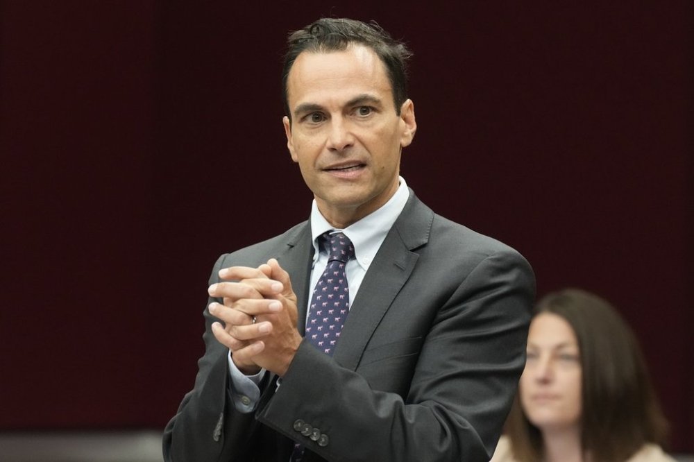 Interim parliamentary budget officer Jason Jacques speaks with a senator as he waits to appear before the Senate Banking, Commerce and the Economy committee in Ottawa, Thursday, Oct. 2, 2025. THE CANADIAN PRESS/Adrian Wyld