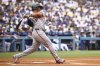 San Francisco Giants designated hitter Rafael Devers follows through on a single during the first inning of a baseball game against the Los Angeles Dodgers, Sunday, Sept. 21, 2025, in Los Angeles. (AP Photo/Jessie Alcheh)