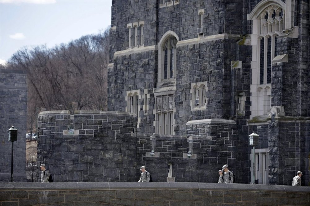 FILE - West Point cadets walk on campus during lunchtime break at the United States Military Academy in West Point, N.Y., April 9, 2014. (AP Photo/Mel Evans, File)