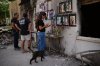 People visit the burnt house of Siman Tov family where all five family members were killed during the Hamas attack on Oct. 7, 2023, in Kibbutz Nir Oz, Israel, a day before Israel marks the two-year anniversary of the attack, Monday, Oct. 6, 2025. (AP Photo/Ohad Zwigenberg)