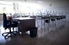 An empty teacher's desk is seen at the front of an empty classroom at McGee Secondary school in Vancouver on Sept. 5, 2014. THE CANADIAN PRESS/Jonathan Hayward