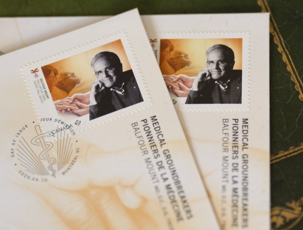 Canadian stamps bearing the image of Dr. Balfour Mount, who died last Thursday in the palliative care unit that bears his name, are on display in Montreal on Tuesday, Sept. 30, 2025. Dr. Mount is recognized as the father of palliative care. THE CANADIAN PRESS/Christinne Muschi