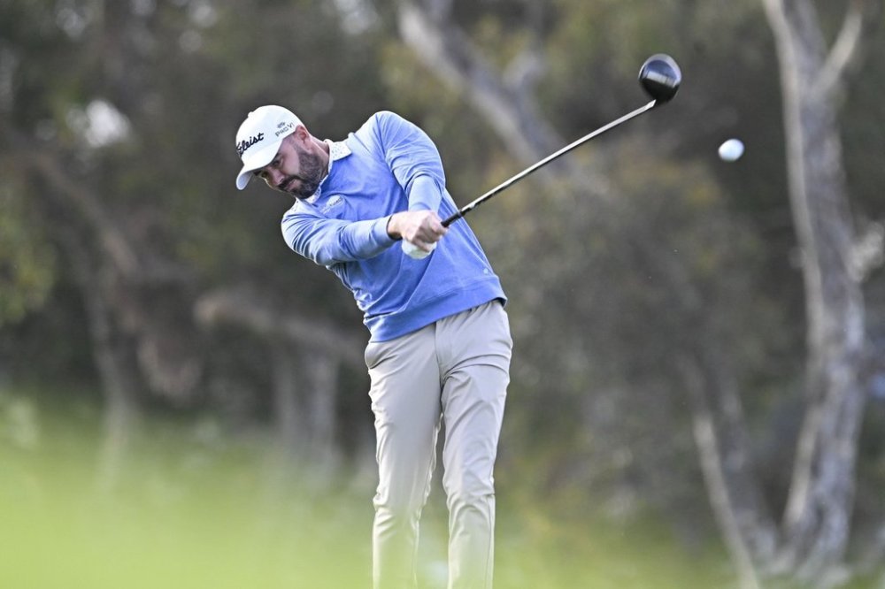 FILE - Troy Merritt hits his tee shot on the seventh hole of the North Course at Torrey Pines during the first round of the Farmers Insurance Open golf tournament, Jan. 22, 2025, in San Diego. (AP Photo/Denis Poroy, file)