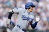 Los Angeles Dodgers Shohei Ohtani runs toward first base as he doubles against the Seattle Mariners during a baseball game, Sunday, Sept. 28, 2025, in Seattle. (AP Photo/John Froschauer)