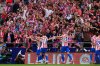 Atletico Madrid players celebrate their side's third goal during the Spanish La Liga soccer match between Atletico Madrid and Real Madrid at Metropolitano stadium, in Madrid, Spain, Saturday, Sept. 27, 2025. (AP Photo/Manu Fernandez)