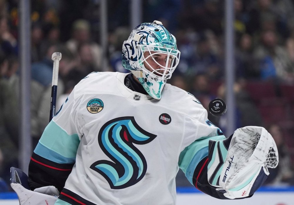 FILE - Seattle Kraken goalie Joey Daccord tosses the puck in the air after the whistle during the third period of an NHL hockey game against the Vancouver Canucks, in Vancouver, on Wednesday, April 2, 2025. (Darryl Dyck/The Canadian Press via AP,File)