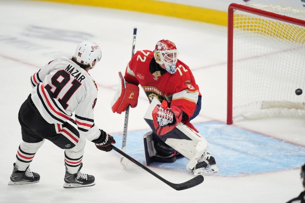 Chicago Blackhawks centre Frank Nazar (91) scores on Florida Panthers goaltender Sergei Bobrovsky (72) during the first period of an NHL hockey game, Tuesday, Oct. 7, 2025, in Sunrise, Fla. (AP Photo/Rebecca Blackwell)