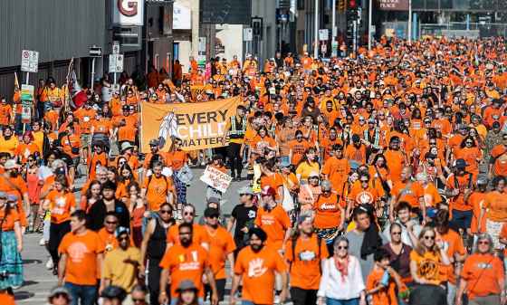 People take part in the Orange Shirt Healing Walk and Powwow in Winnipeg Tuesday. (John Woods / Free Press)