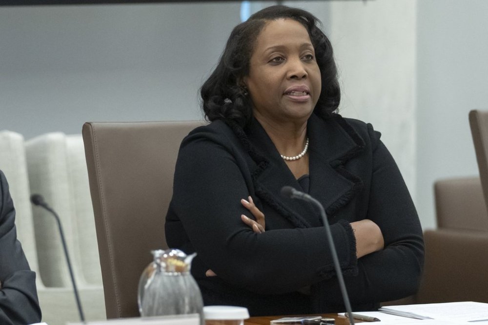 FILE - Federal Reserve Board of Governors member Lisa Cook listens during an open meeting of the Board of Governors at the Federal Reserve, June 25, 2025, in Washington. (AP Photo/Mark Schiefelbein, File)