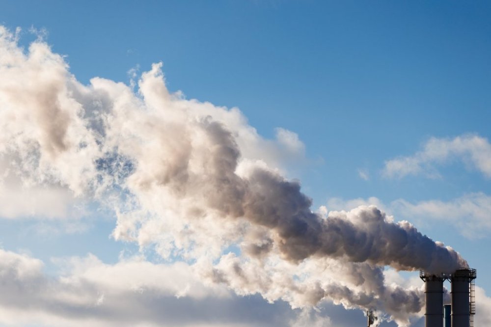 Emissions flow from a factory's smokestacks on a cold winter day in Toronto, Wednesday, Jan. 8, 2025. THE CANADIAN PRESS/Cole Burston