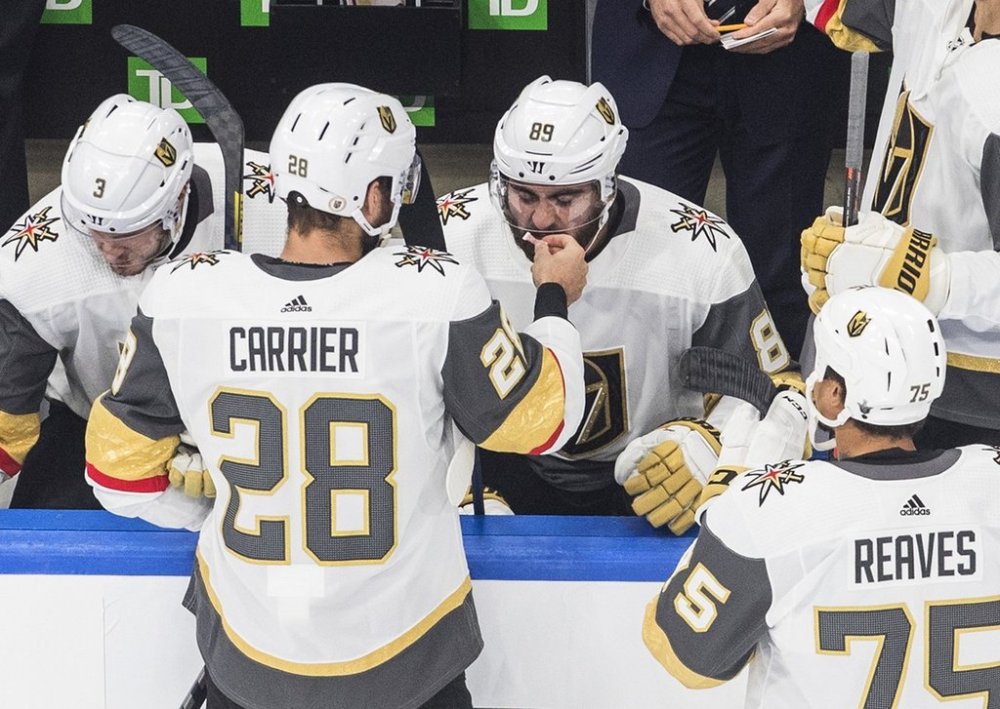 Vegas Golden Knights forwards William Carrier (28) and Alex Tuch (89) share smelling salts before taking on the Vancouver Canucks during NHL playoff action in Edmonton on Sunday, Aug. 30, 2020. THE CANADIAN PRESS/Jason Franson