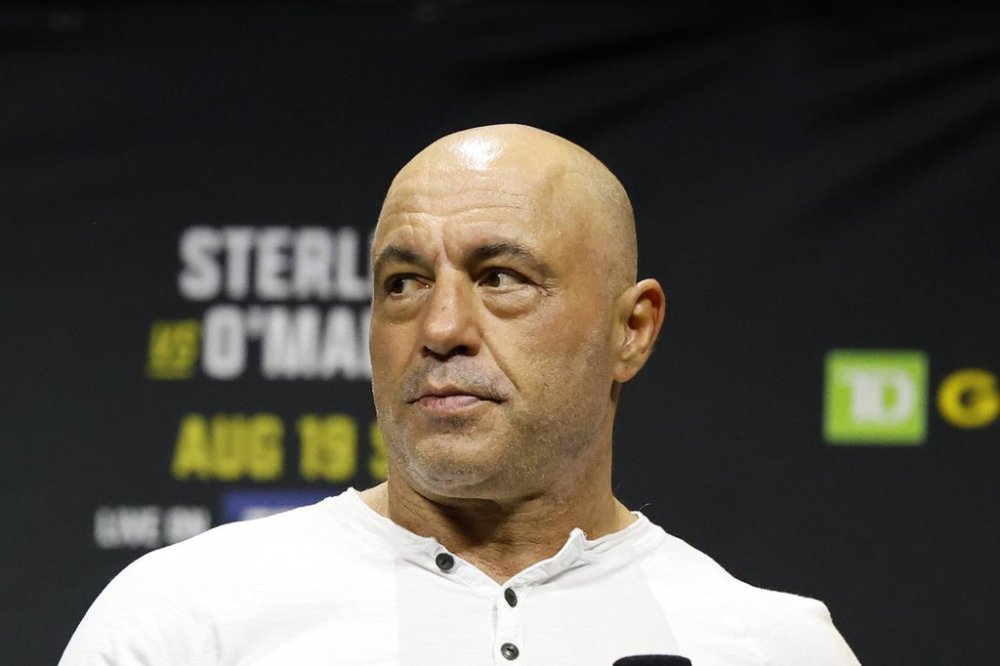 Joe Rogan is seen at the ceremonial weigh-in for the UFC 292 mixed martial arts event, Friday, Aug. 18, 2023, in Boston. Rogan and his guest on a January 2024 podcast falsely implied the COVID-19 vaccine fuelled Canada's drop in life expectancy from 2020 to 2022. Statistics Canada data shows COVID-19 was among the leading causes of death in Canada in 2020, 2021 and 2022. THE CANADIAN PRESS/AP-Gregory Payan