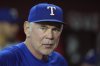 Texas Rangers manager Bruce Bochy pauses in the team dugout prior to a baseball game against the Arizona Diamondbacks Wednesday, Sept. 3, 2025, in Phoenix. (AP Photo/Ross D. Franklin)