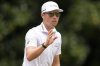 Ben Griffin waves to spectaots on the second green during the third round of the Tour Championship golf tournament, Saturday, Aug. 23, 2025, in Atlanta. (AP Photo/Mike Stewart)