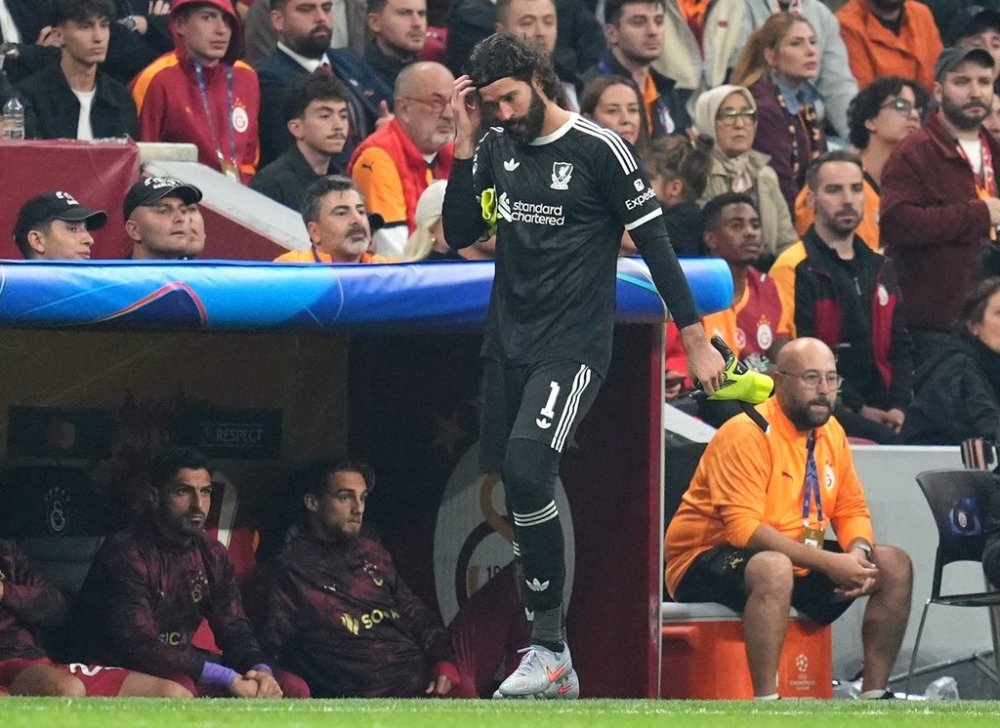 Liverpool goalkeeper Alisson Becker walks near the sideline after being substituted off for a possible injury during the UEFA Champions League, league stage soccer match at RAMS Park in Istanbul, Turkey, Tuesday, Sept. 30, 2025. (Adam Davy/PA via AP)