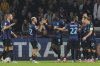 Inter Milan players celebrate with Inter Milan's Marcus Thuram, number 9, after he scored his side's first goal during a Champions League opening phase soccer match between Ajax and Inter Milan at the Johan Cruyff ArenA in Amsterdam, Netherlands, Wednesday, Sept. 17, 2025. (AP Photo/Patrick Post)