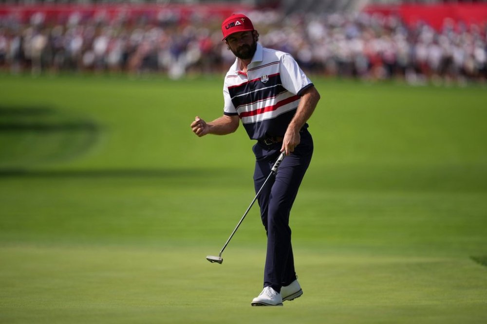 United States' Cameron Young celebrates after a putt on the first hole during their singles match on the Bethpage Black golf course at the Ryder Cup golf tournament, Sunday, Sept. 28, 2025, in Farmingdale, N.Y. (AP Photo/Matt Slocum)
