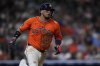 FILE - Houston Astros' Isaac Paredes runs to first after hitting a single during the seventh inning of a baseball game against the Texas Rangers, Friday, July 11, 2025, in Houston. (AP Photo/Kevin M. Cox, File)
