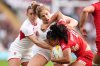 England's Abby Dow tackles Canada's Asia Hogan-Rochester during the Women's Rugby World Cup final match between England and Canada at the Allianz Stadium, Twickenham, London, Saturday, Sept. 27, 2025. (Ben Whitley/PA via AP)