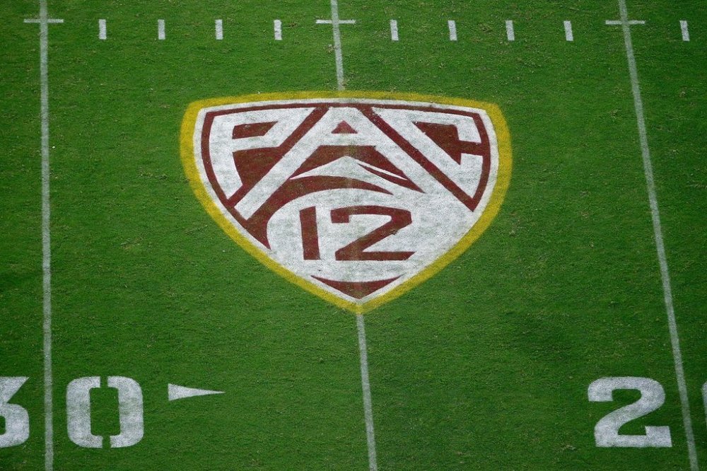 FILE - The PAC-12 logo at Sun Devil Stadium is displayed on the field during the second half of an NCAA college football game between Arizona State and Kent State in Tempe, Ariz., Aug. 29, 2019. (AP Photo/Ralph Freso, File)