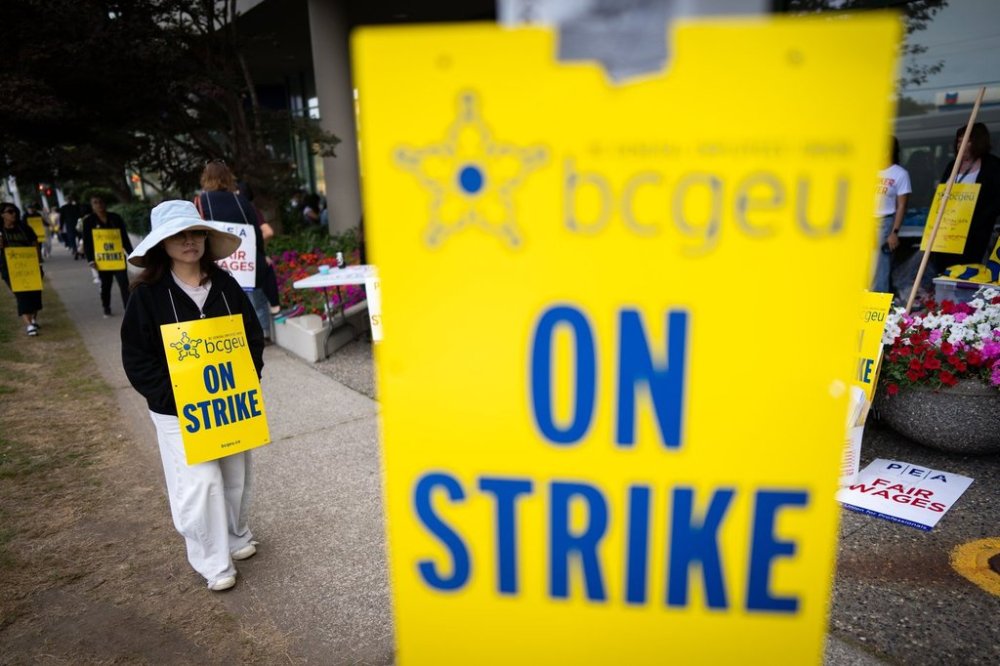 A member of the British Columbia General Employees' Union pickets outside an ICBC driver licensing office, in Surrey, B.C., Monday, Sept. 8, 2025. THE CANADIAN PRESS