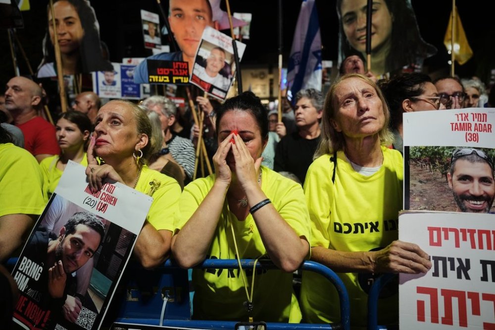 Relatives and supporters of Israeli hostages held in the Gaza Strip attend a rally demanding their release from Hamas captivity and calling for an end to the war, in Tel Aviv, Israel, Saturday, Sept. 27, 2025. (AP Photo/Ariel Schalit)