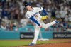 Los Angeles Dodgers relief pitcher Roki Sasaki throws to a Cincinnati Reds batter during the ninth inning in Game 2 of the National League Wild Card baseball playoff series Wednesday, Oct. 1, 2025, in Los Angeles. (AP Photo/Mark J. Terrill)