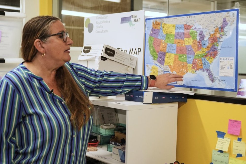 FILE - Dr. Angel Foster, co-founder of Massachusetts Medication Abortion Access Project, points out on a map of the United States on May 13, 2025, in Somerville, Mass., to show where her organization provides care. (AP Photo/Charles Krupa, File)