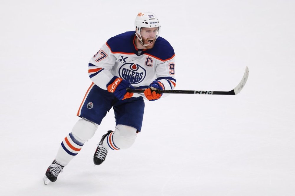 FILE - Edmonton Oilers center Connor McDavid celebrates after scoring against the Dallas Stars during the second period of Game 5 of the Western Conference finals in the NHL hockey Stanley Cup playoffs, May 29, 2025, in Dallas. (AP Photo/Gareth Patterson, file)