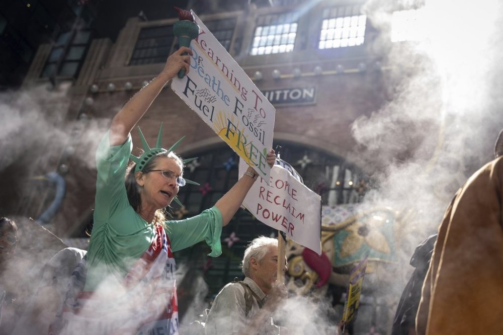 A woman dressed as the Statue of Liberty marches through Manhattan in the