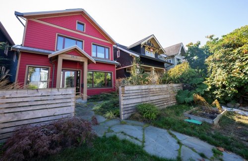 A home in the Kitsilano neighbourhood of Vancouver is pictured Monday, Oct. 3, 2022.  The two-storey family home with a classic design and wooden cladding blends in with its neighbours, but its thick, insulated walls, solar panels, heat pump and highly efficient windows mean it's a home built for the future in a warming world. THE CANADIAN PRESS/Jonathan Hayward