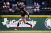 Minnesota Twins' Byron Buxton reacts after hitting a leadoff home run on the first pitch of the game thrown by Texas Rangers starting pitcher Tyler Mahle during the first inning of a baseball game Thursday, Sept. 25, 2025, in Arlington. (AP Photo/Julio Cortez)