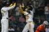 Athletics' Shea Langeliers (23) celebrates his solo home with Tyler Soderstrom, left, during the seventh inning of a baseball game against the Houston Astros, Wednesday, Sept. 24, 2025, in West Sacramento, Calif. (AP Photo/Scott Marshall)