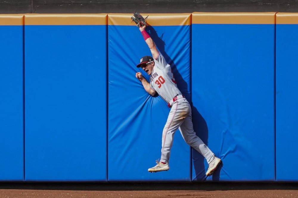 Washington Nationals outfielder Jacob Young catches a fly ball hit by New York Mets' Brett Baty during the fifth inning of a baseball game Sunday, Sept. 21, 2025, in New York. (AP Photo/Yuki Iwamura)