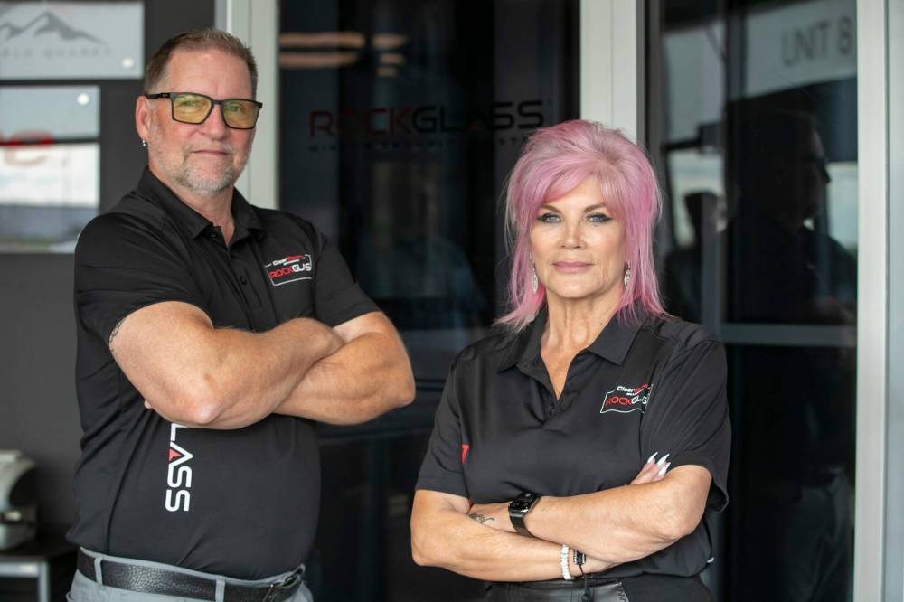 BROOK JONES / FREE PRESS
ClearSecure vice-president Vince Croker and president Colleen Munro in front of one of their company’s impact-resistant glass doors
