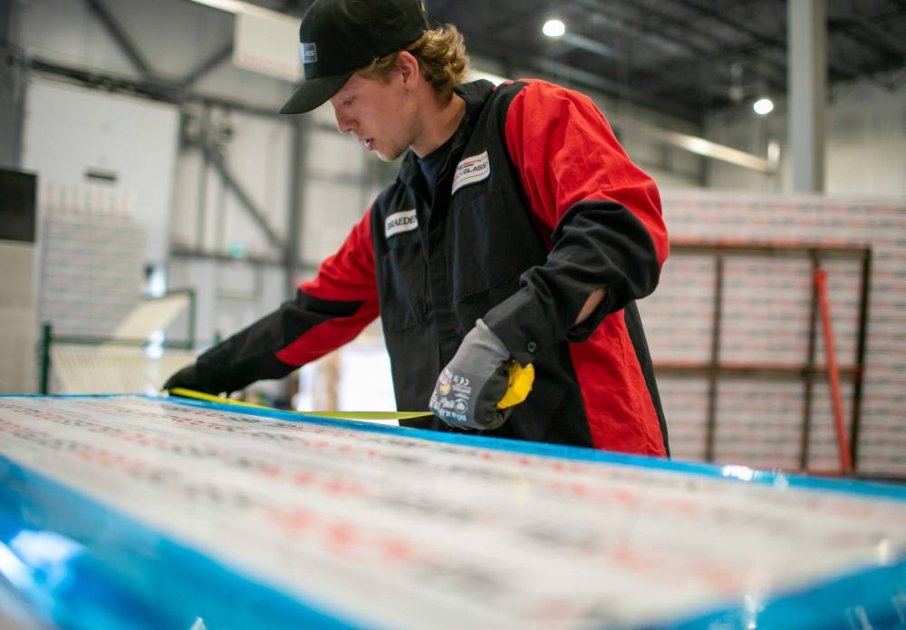 BROOK JONES / FREE PRESS
ClearSecure Manufacturing & Distribution fabricator Braeden Hay measures a panel of RockGlass while working at the company’s headquarters at CentrePort Canada (8-3149 Red Fife Rd.) in the RM of Rosser.
