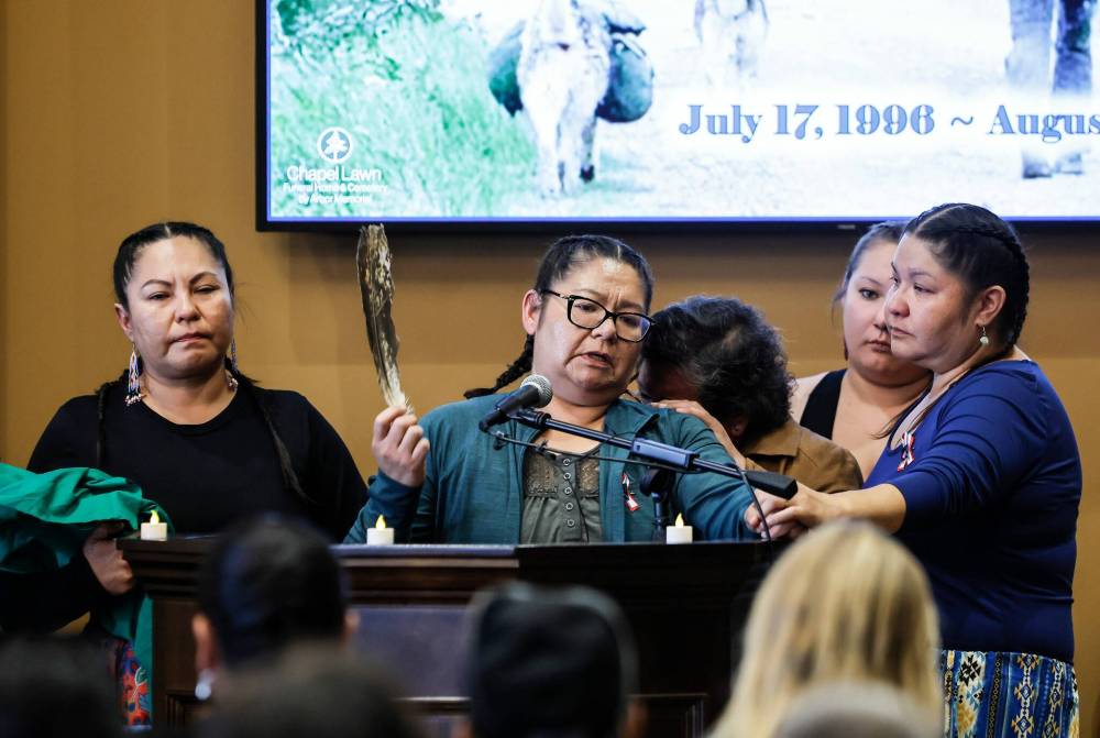 JOHN WOODS / FREE PRESS
Madeline Hunter and her family speak during the service.