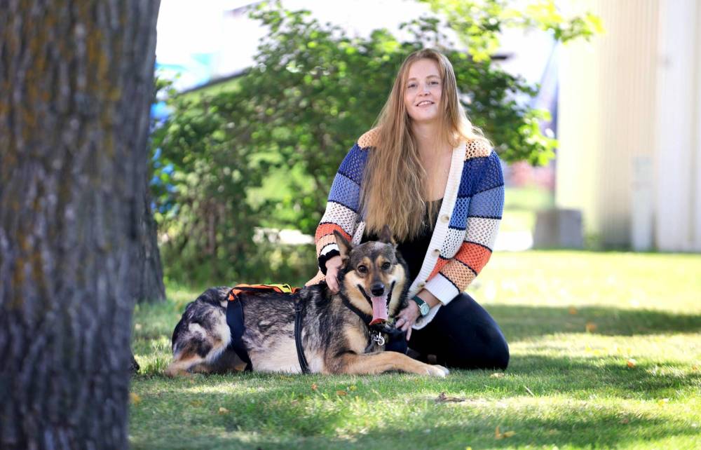 RUTH BONNEVILLE / FREE PRESS
Kendra Drever with Xena, a 2-year-old lively stray that she took on a walk from the Animal Services Agency. Drever volunteers with the agency’s Doggie Dates program.