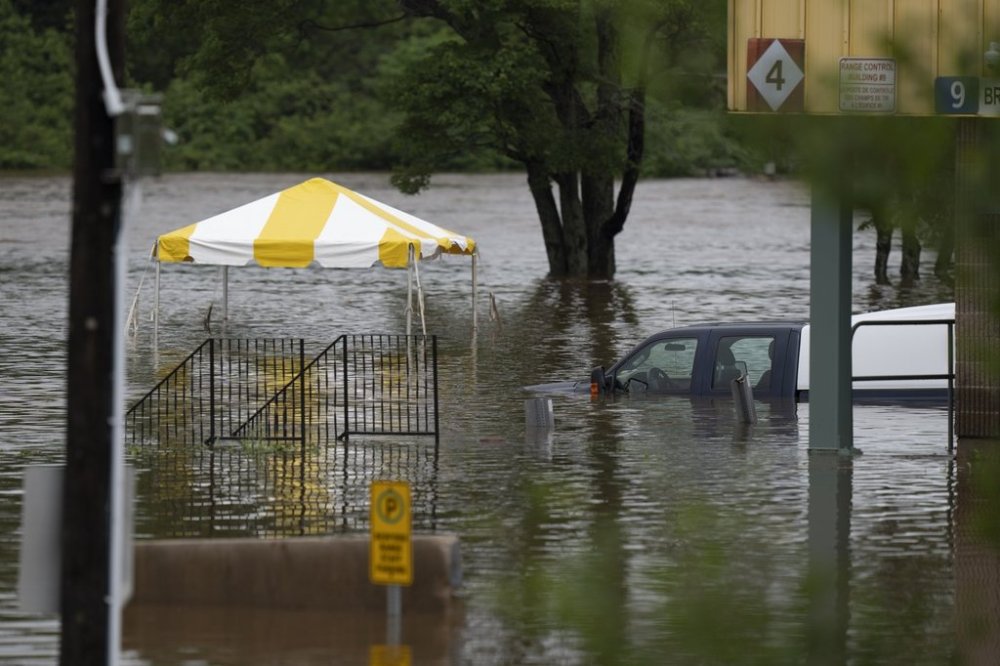 A truck is seen abandoned in floodwater following a major rain event in Halifax, on Saturday, July 22, 2023. THE CANADIAN PRESS/Darren Calabrese