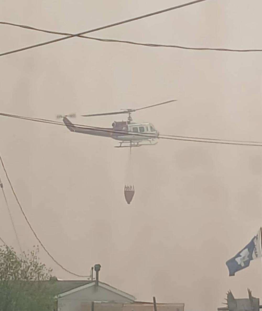 JUDITH MOORE PHOTO
A helicopter fights the fire at Mathias Colomb Cree Nation on May 29.