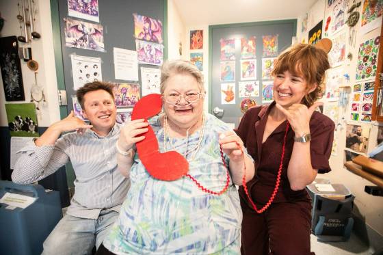 Cheryl Towers, a Misericordia Place personal care resident who gave advice for the new advice hotline (centre), in her room with artists-in-residence Toby Gillies (left) and Natalie Baird. (Mikaela MacKenzie / Free Press)