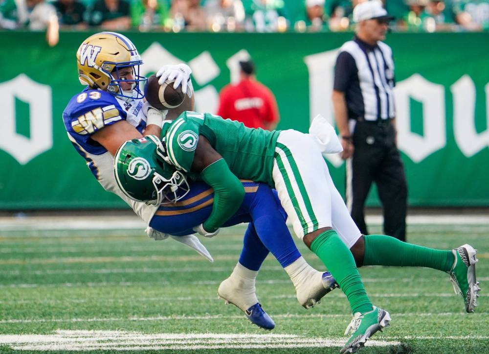Heywood Yu / THE CANADIAN PRESS
Roughriders DB Rolan Milligan (right) tackles Bombers receiver Dalton Schoen during Sunday’s Labour Day Classic.