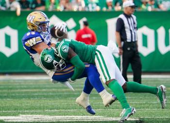 Heywood Yu / THE CANADIAN PRESS
                                Roughriders DB Rolan Milligan (right) tackles Bombers receiver Dalton Schoen during Sunday’s Labour Day Classic.