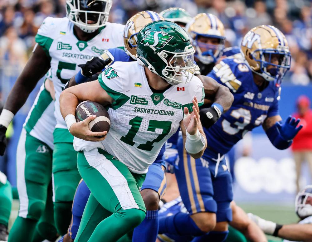 JOHN WOODS / THE CANADIAN PRESS
Saskatchewan Roughriders quarterback Tommy Stevens (17) runs for the first down against the Winnipeg Blue Bombers during second half CFL action in Winnipeg, Saturday, Sept. 6, 2025.