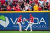 Cincinnati Reds outfielder Noelvi Marte (16) celebrates with teammate TJ Friedl (29) after catching a fly ball hit by Pittsburgh Pirates' Bryan Reynolds during the ninth inning of a baseball game, Thursday, Sept. 25, 2025, in Cincinnati. (AP Photo/Jeff Dean)