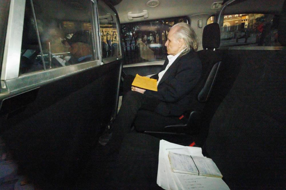 COLE BURSTON / THE CANADIAN PRESS FILES
Peter Nygard is set to stand trial in December on charges he sexually assaulted and forcibly confined a then-20-year-old woman in 1993 at his former corporate headquarters in Winnipeg. His lawyer has asked a judge to throw out the case.
Seen through a police vehicle window, Peter Nygard arrives to a Courthouse in Toronto, Ontario, Canada, on Tuesday, October 3, 2023 as the trial for former fashion executive Peter Nygard’s charges of sexual assaults continues in a Toronto courtroom. THE CANADIAN PRESS/Cole Burston